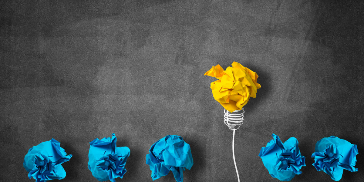 In search of great idea Inspiration concept with crumpled paper light bulb as good idea